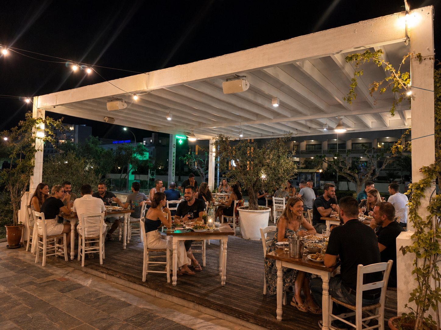 The taverna terrace lit at night